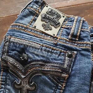 Rock Revival Blue Jeans with Ornate Stitching and Vintage Look